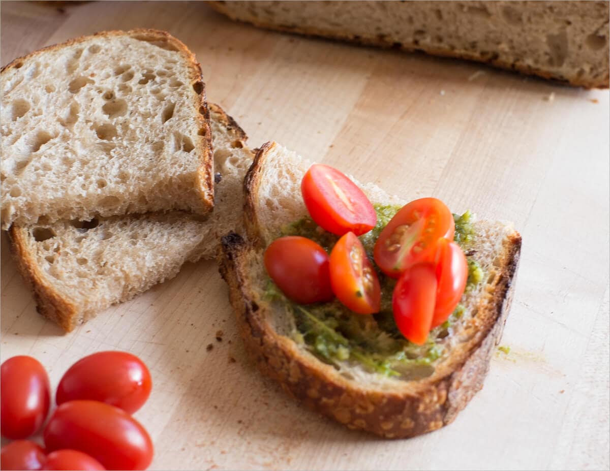 Fresh pesto, tomatoes, and sourdough