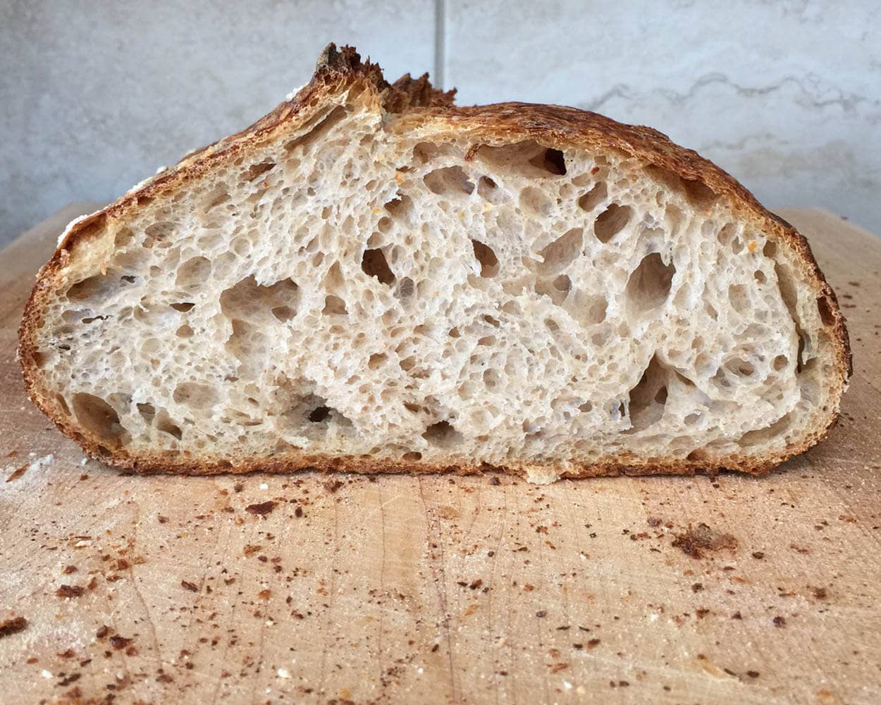 For anyone trying to achieve the effect of a dutch oven but like sandwich  loaves. A turkey pan does a great job of keeping in the steam and adding to  the oven