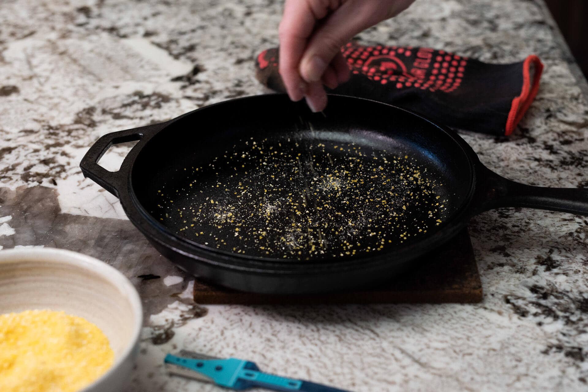 Sprinkle cornmeal into combo cooker (or Dutch oven)