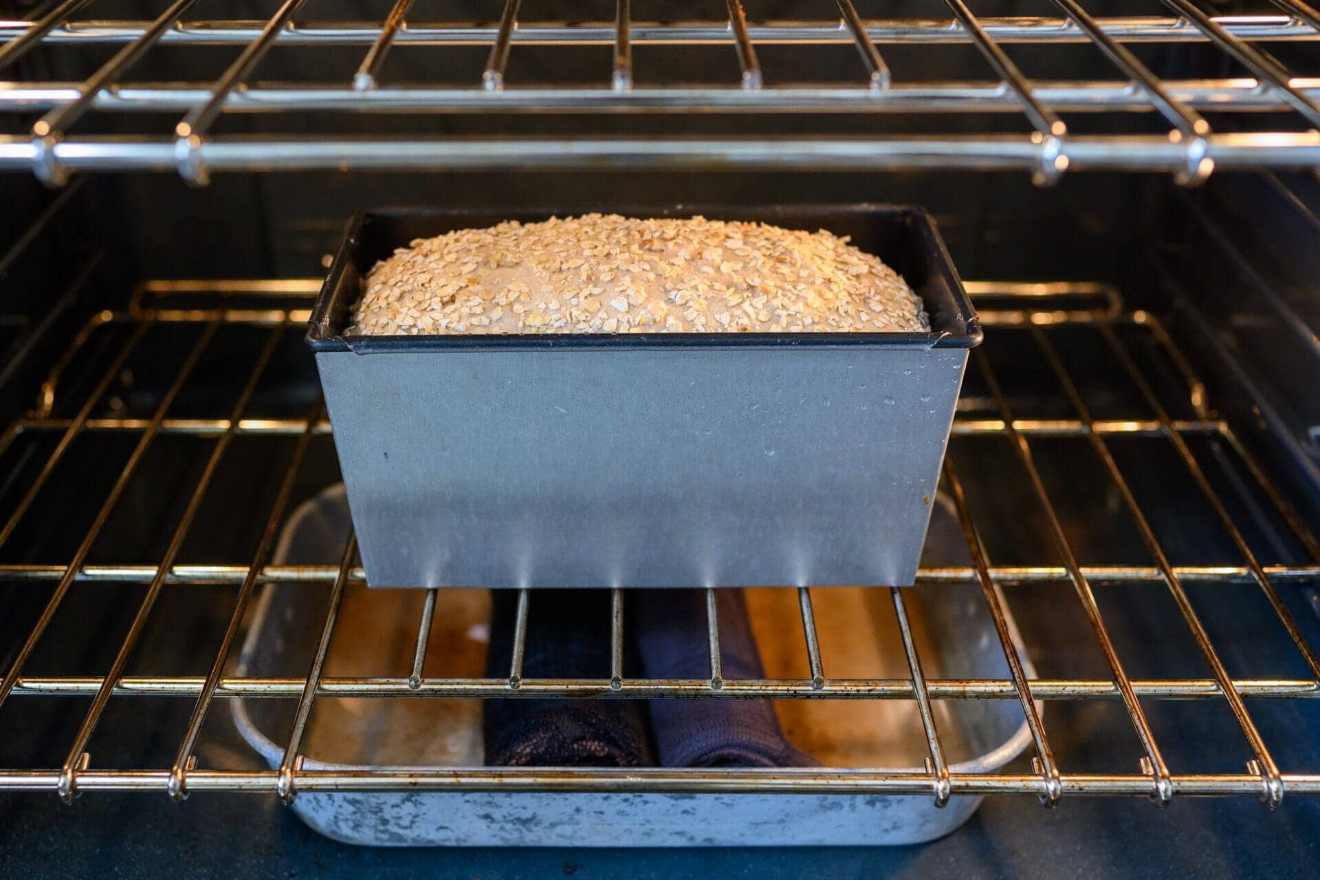 Honey whole wheat dough baking in oven with steam