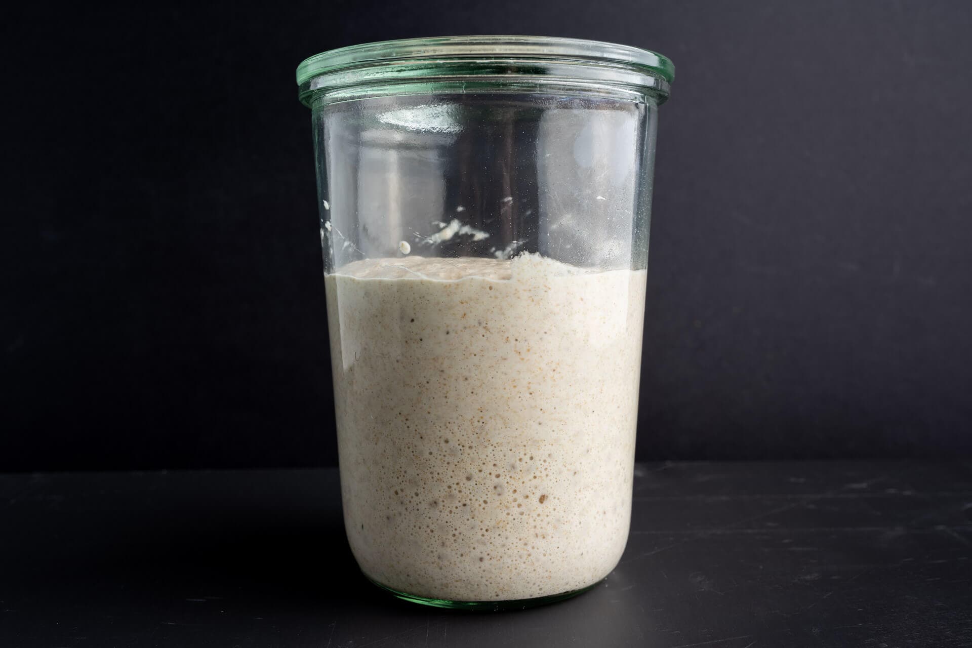 Homemade sourdough bread, natural leaven for bread in a glass jar