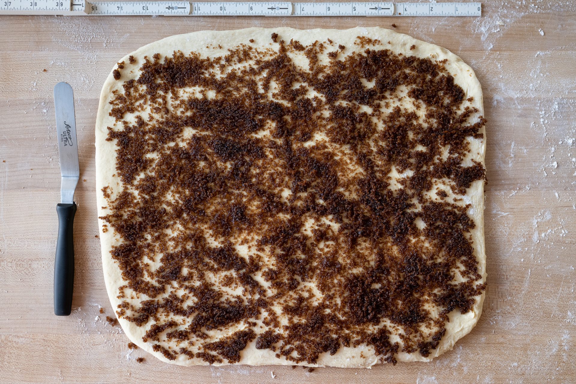 Cardamom and cinnamon filling spread on dough
