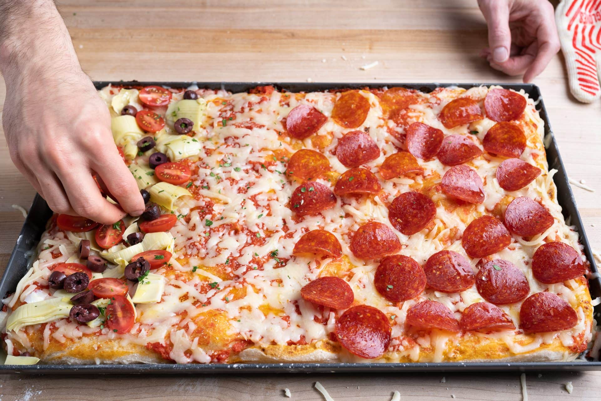 Place toppings on parbaked pizza dough