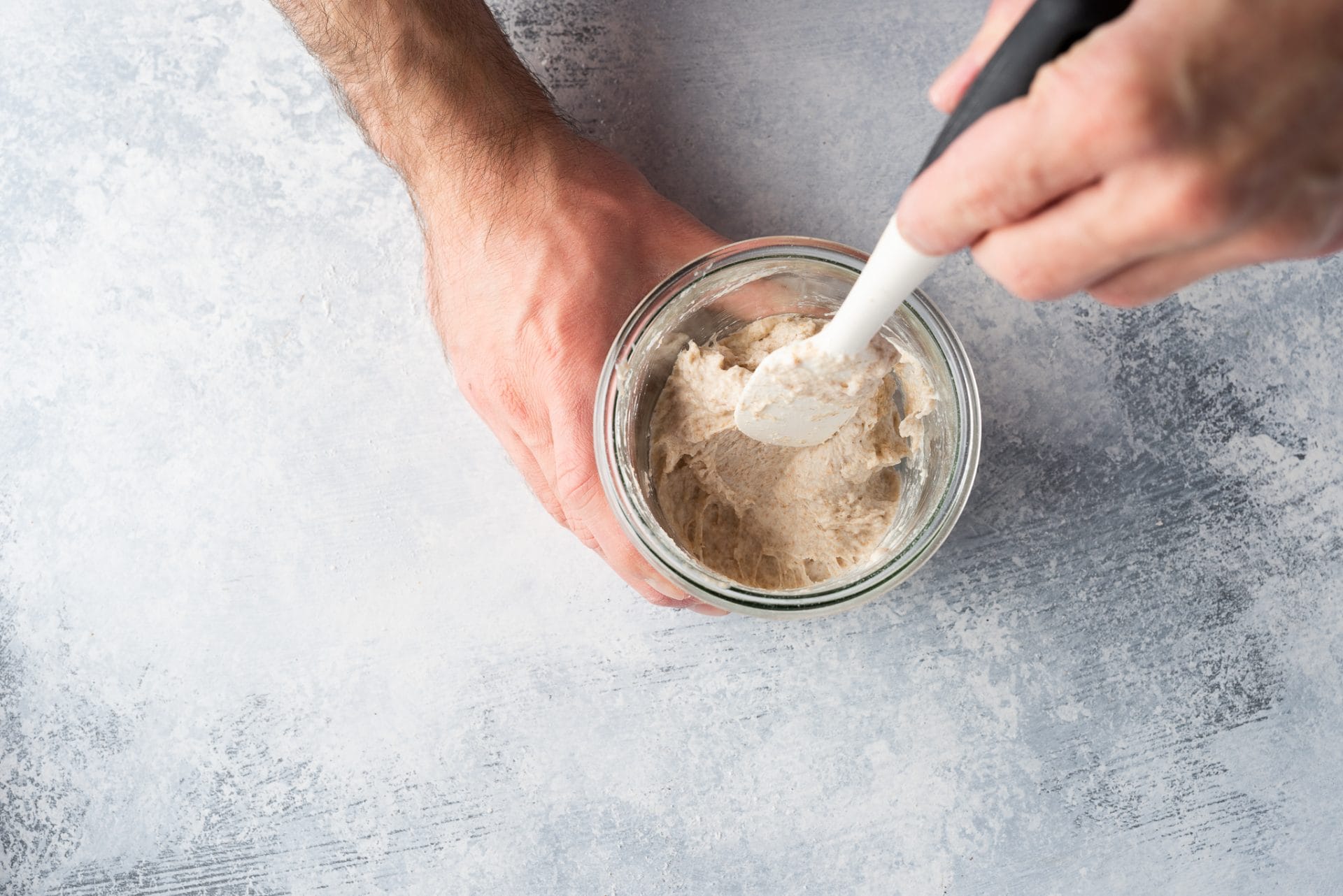 How do I feed my sourdough starter?