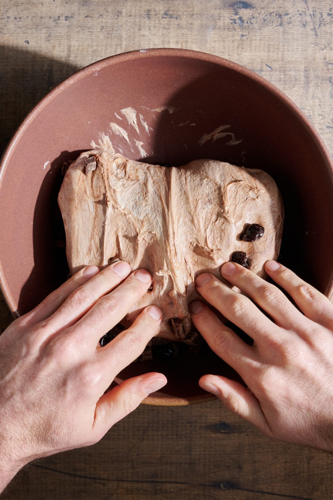 Adding chocolate and cherries to sourdough bread dough