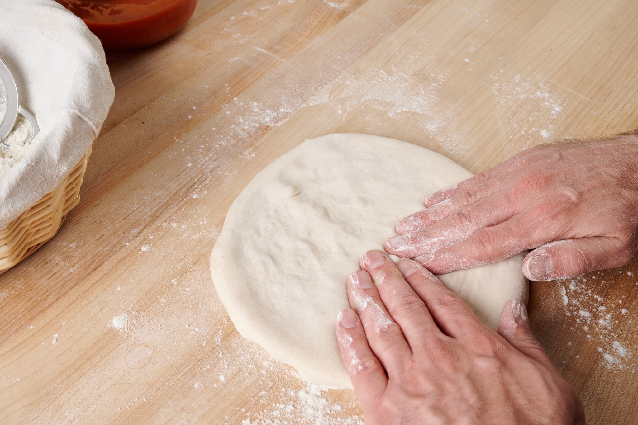 Stretching sourdough pizza dough