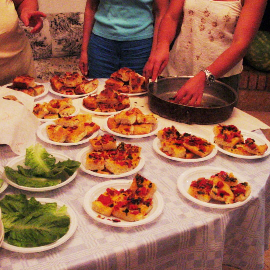 Having Focaccia Pugliese with my family in Ceglie, 2003 (yikes!).