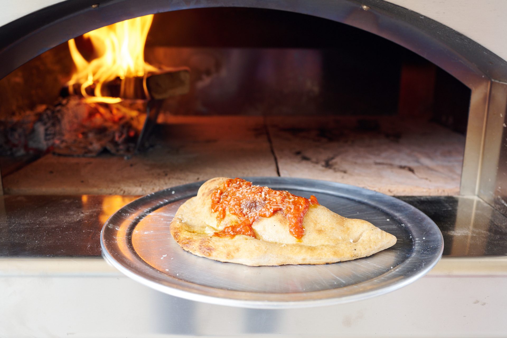 Baking a calzone in my Fontana Forni wood fired oven.