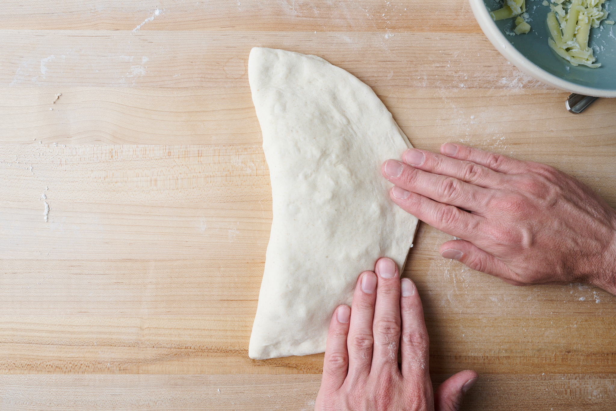 Align calzone dough edges