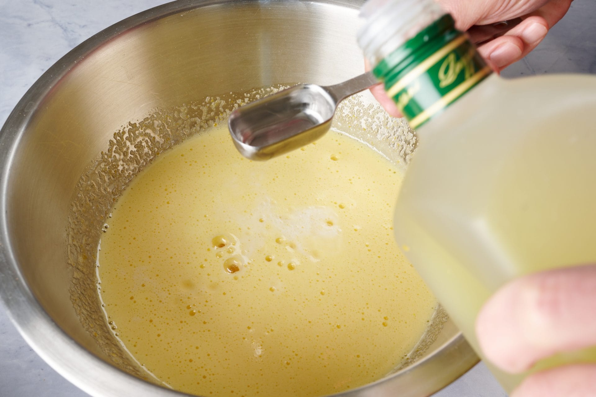 Adding limoncello to ciambella batter