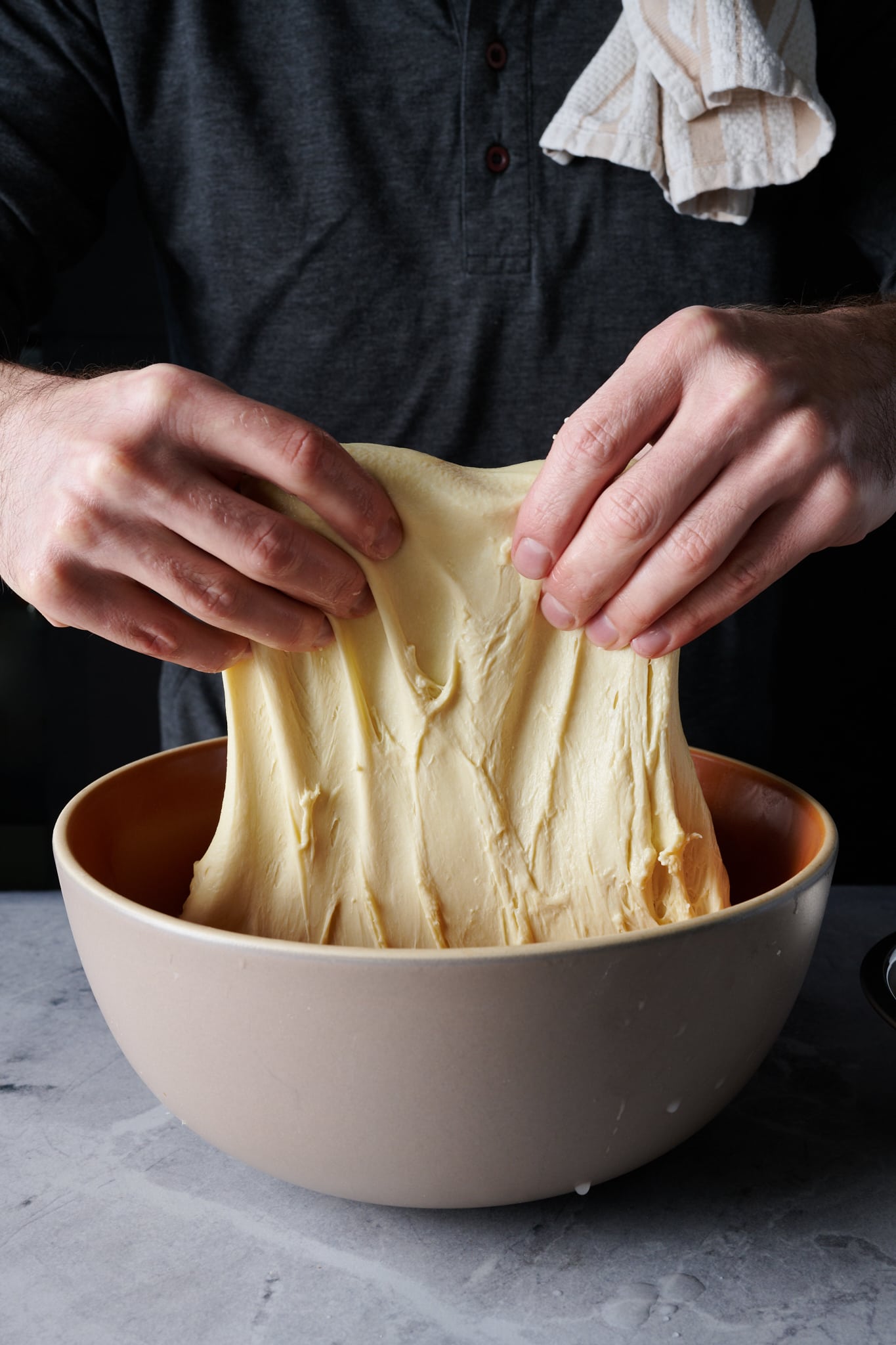 Stretching and folding durum bread dough.