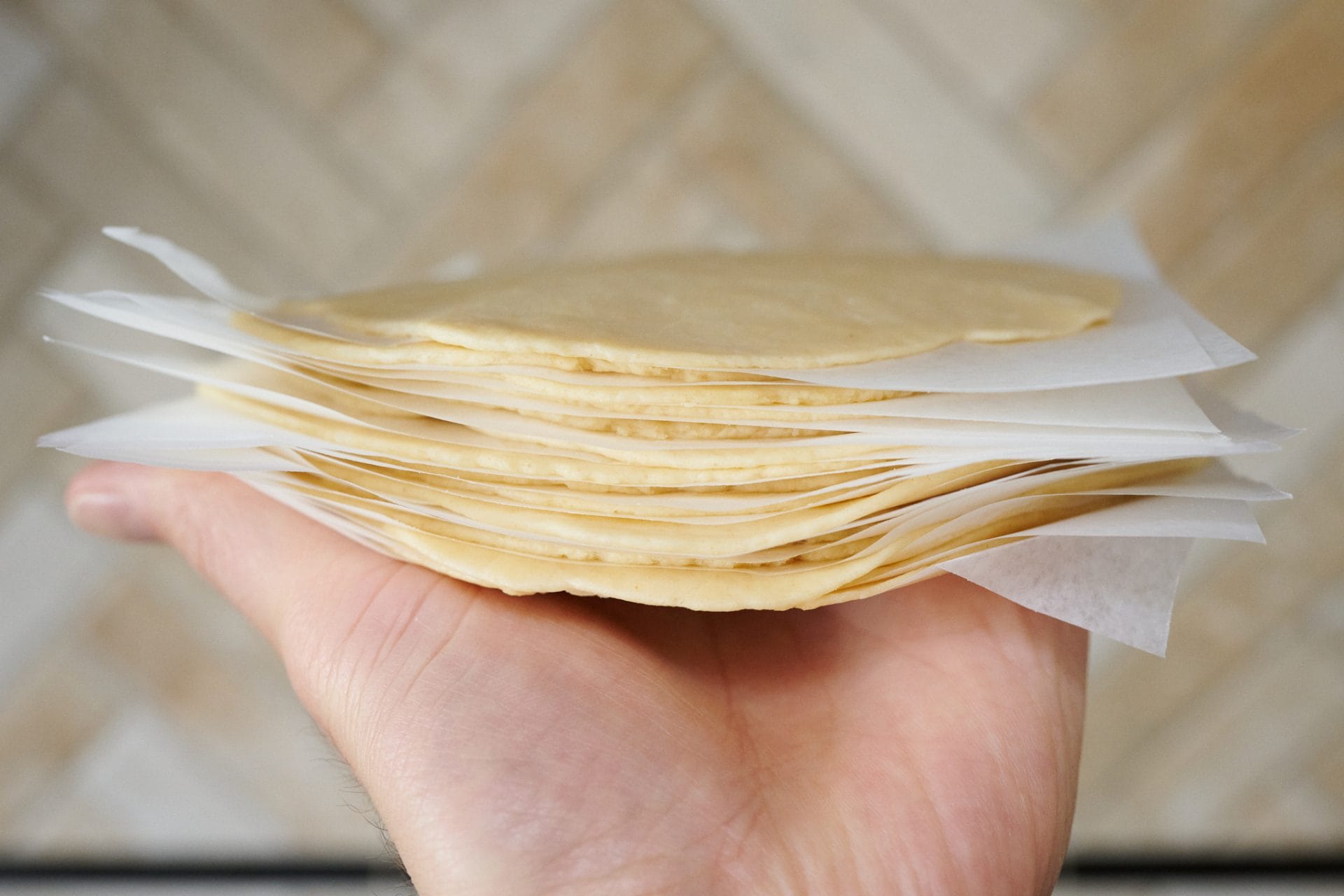 Stack of pressed out sourdough tortillas ready for the freezer.