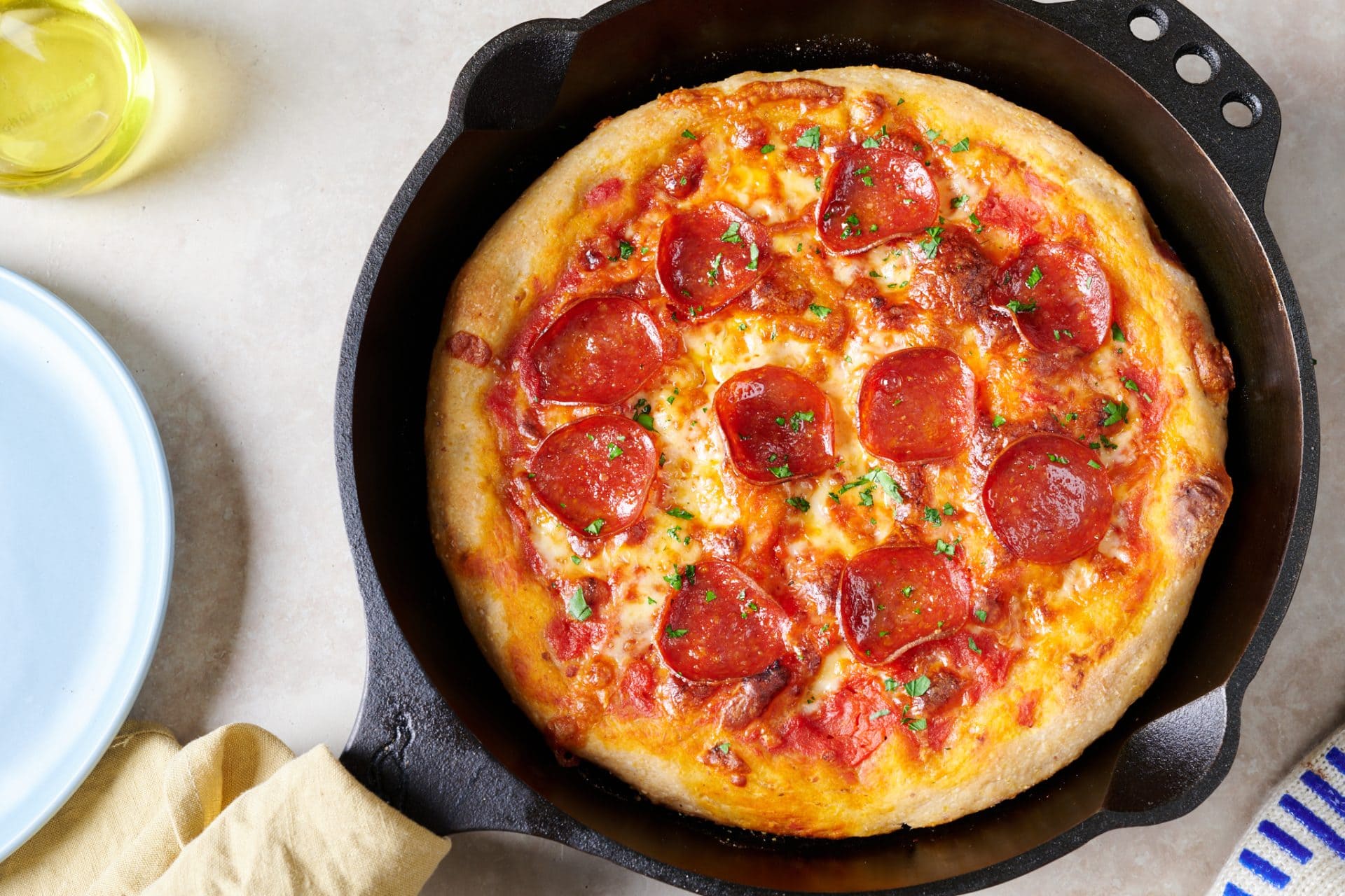 Cornmeal skillet sourdough pizza with pepperoni.