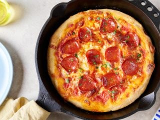 Cornmeal skillet sourdough pizza with pepperoni.