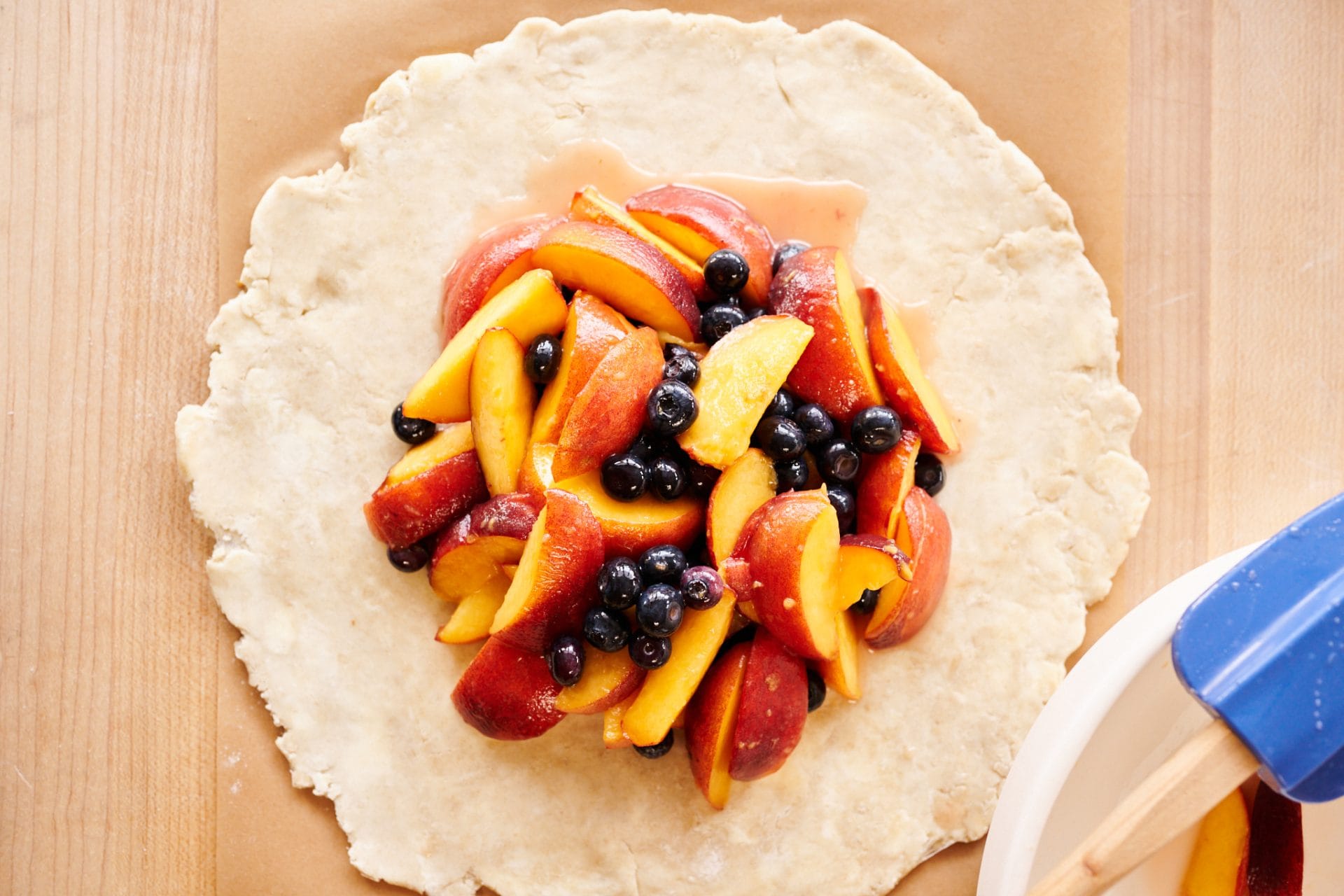 Sourdough pie crust filled with peaches and blueberries.