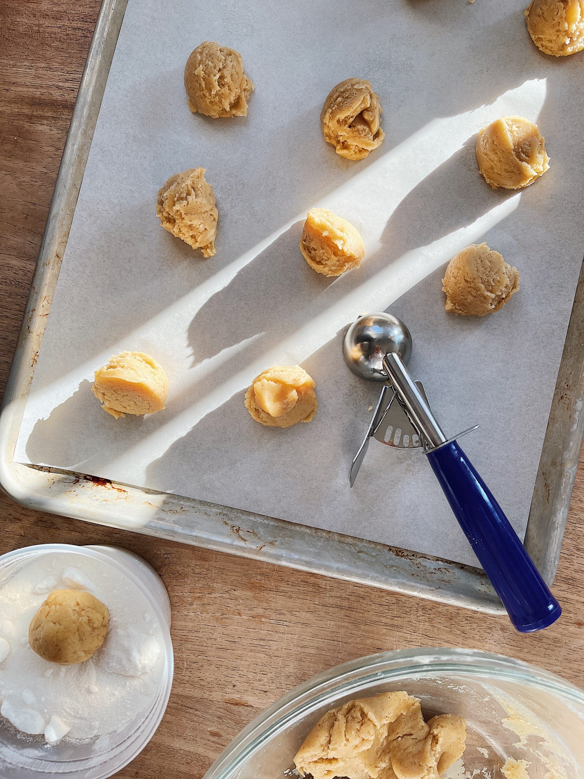 Portioning out sourdough starter discard sugar cookie dough.