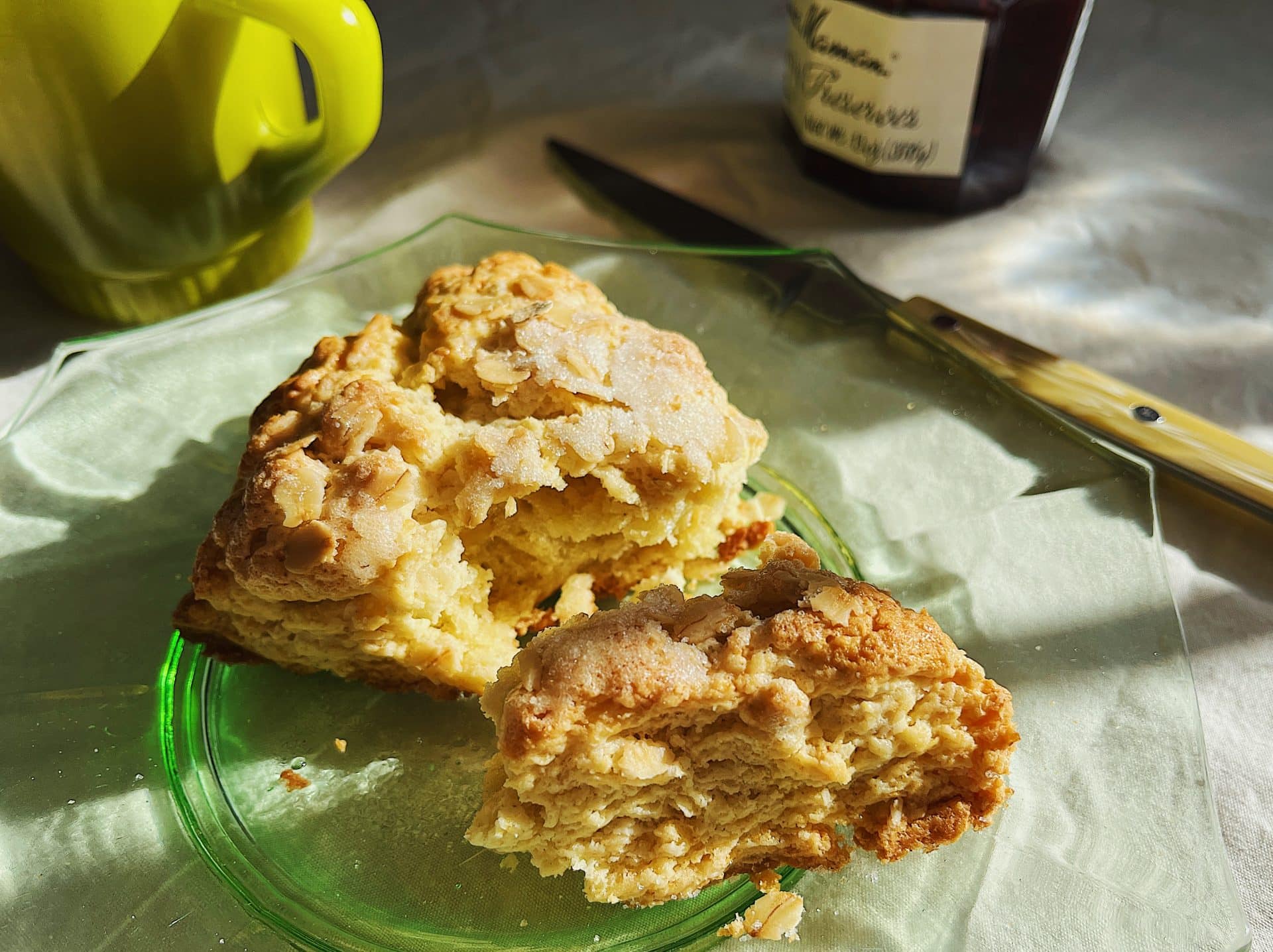 A sourdough starter scone broken showing tender interior.