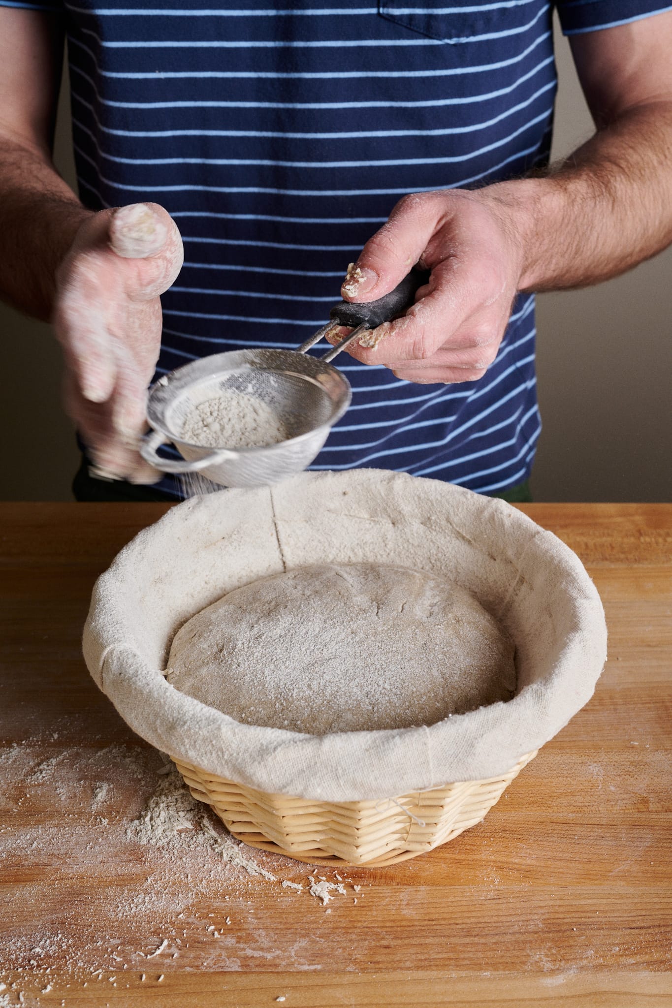 Dust the top of the shaped rye dough with rye flour.