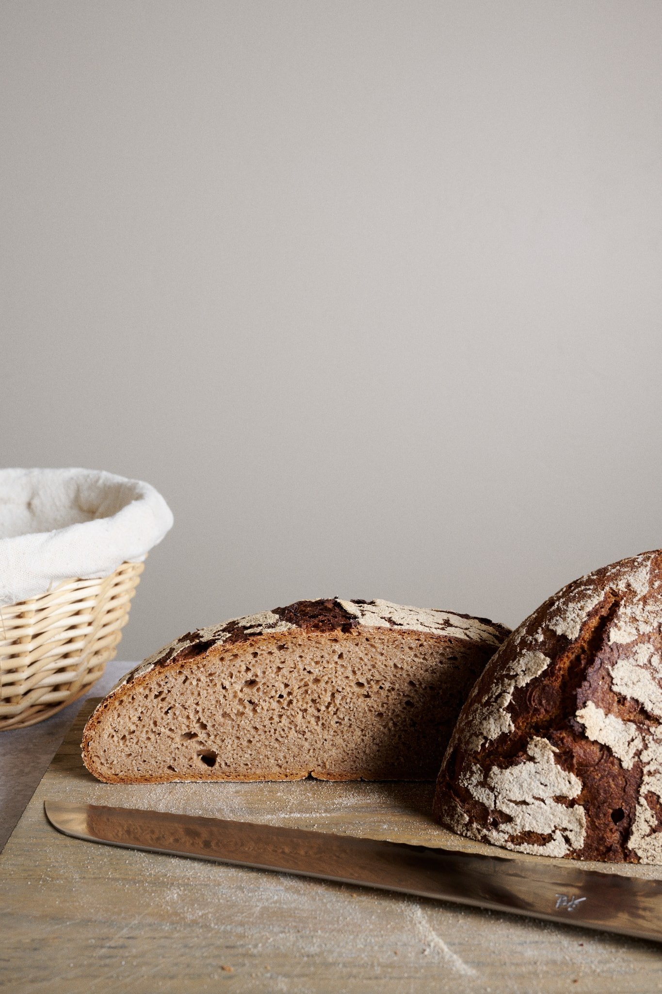 Sourdough rye bread sliced open on cutting board.