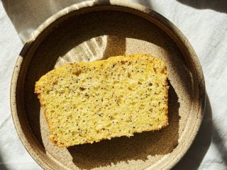 Slice of lemon poppyseed loaf showing tender interior.