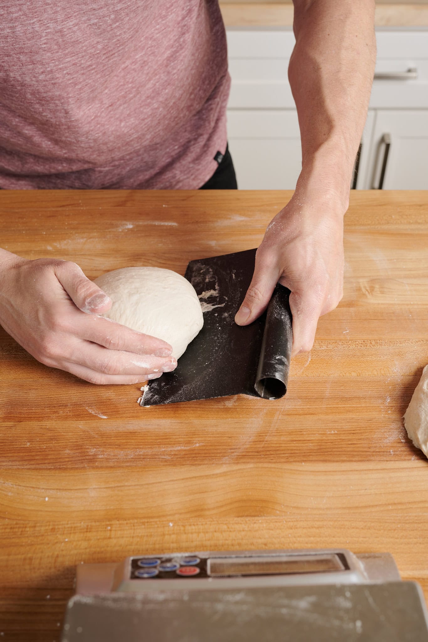 Balling Detroit-style pizza dough.