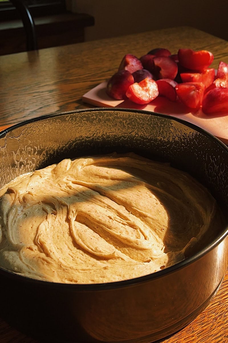 Batter in pan and ready for plums.