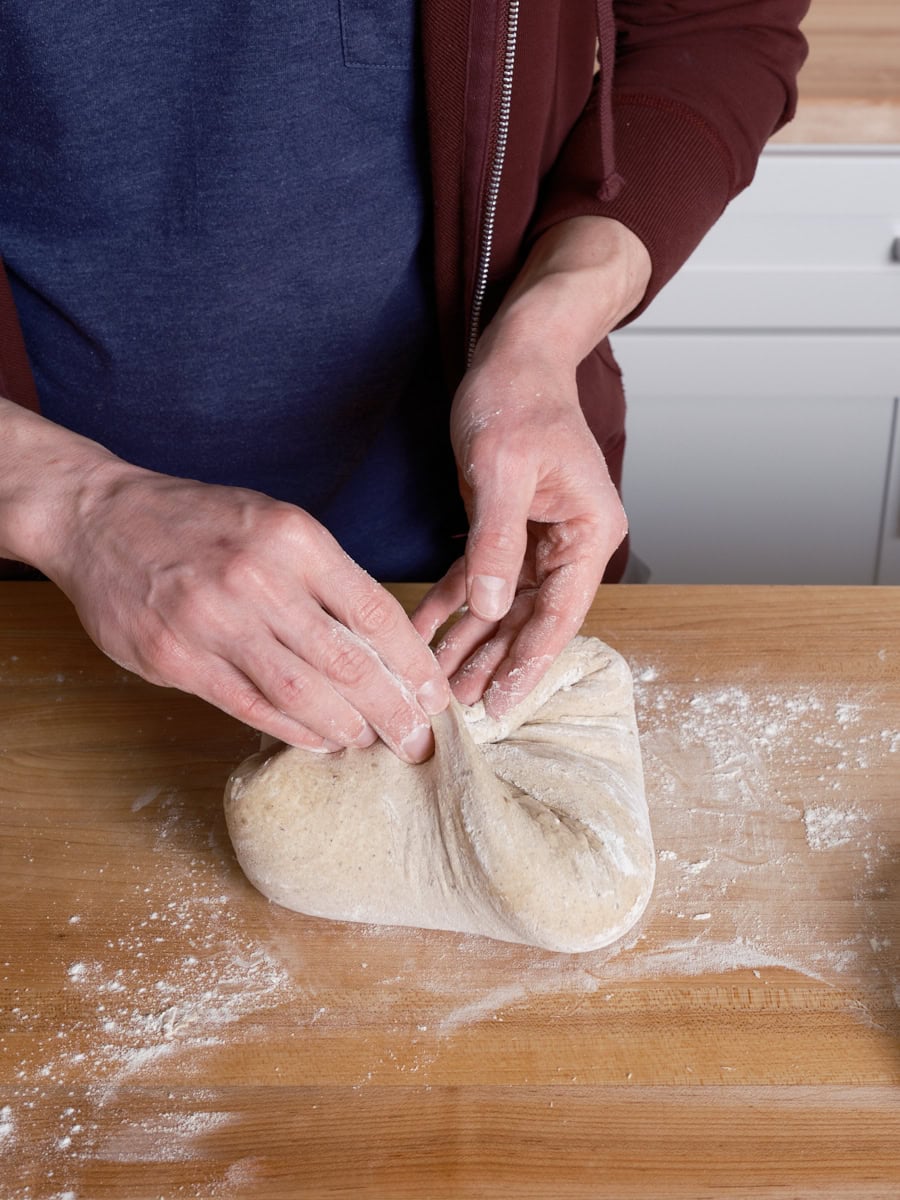 Shaping bread dough with the gather up method.